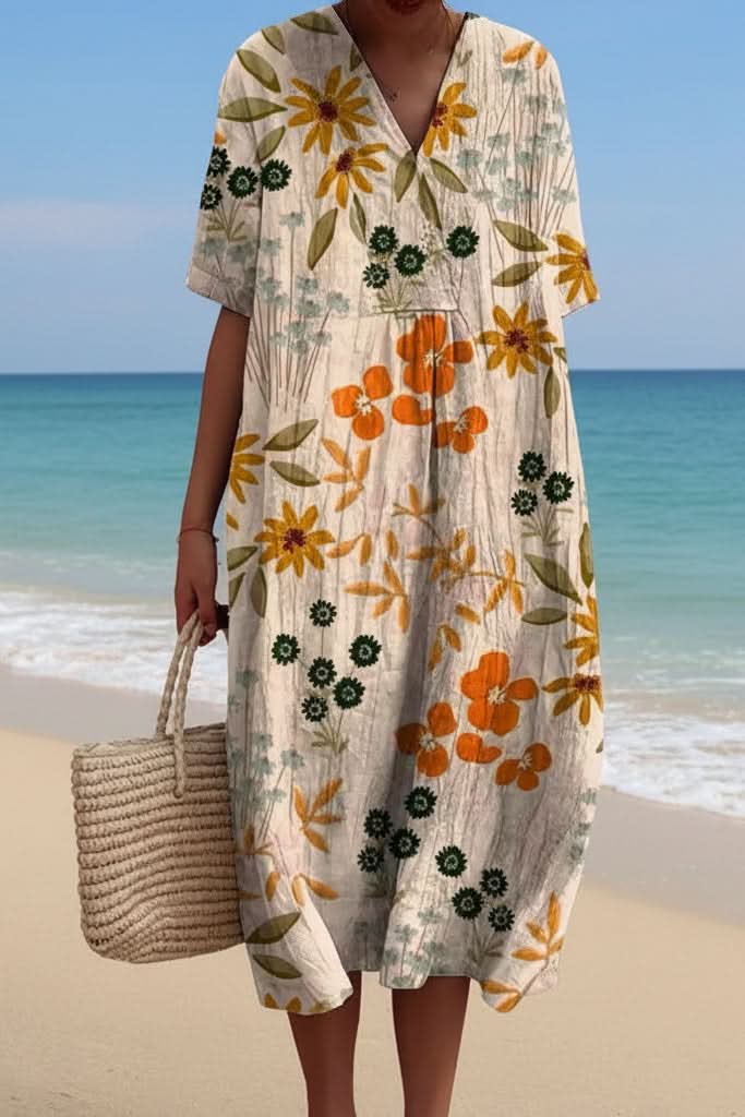 Stylish women's V-neck midi dress in a beautiful floral print, a must-have for summer vacations and casual spring days.