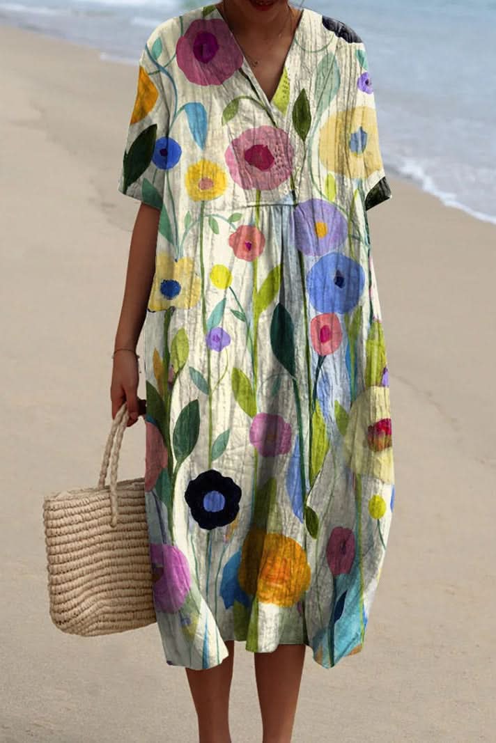 Chic women's summer midi dress with a charming floral pattern and flattering V-neckline, great for everyday style.