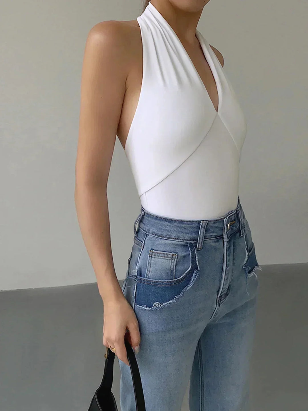 Comfortable everyday women's halter top, sleeveless with a V-neck, offering versatile style.