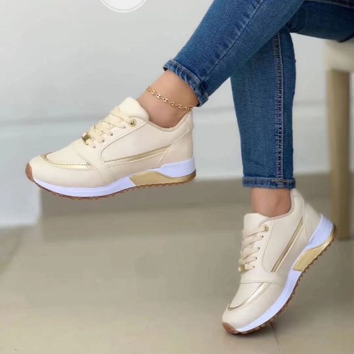 Women's chic lace-up platform sneakers with elegant gold trim, perfect for everyday casual wear & comfort.