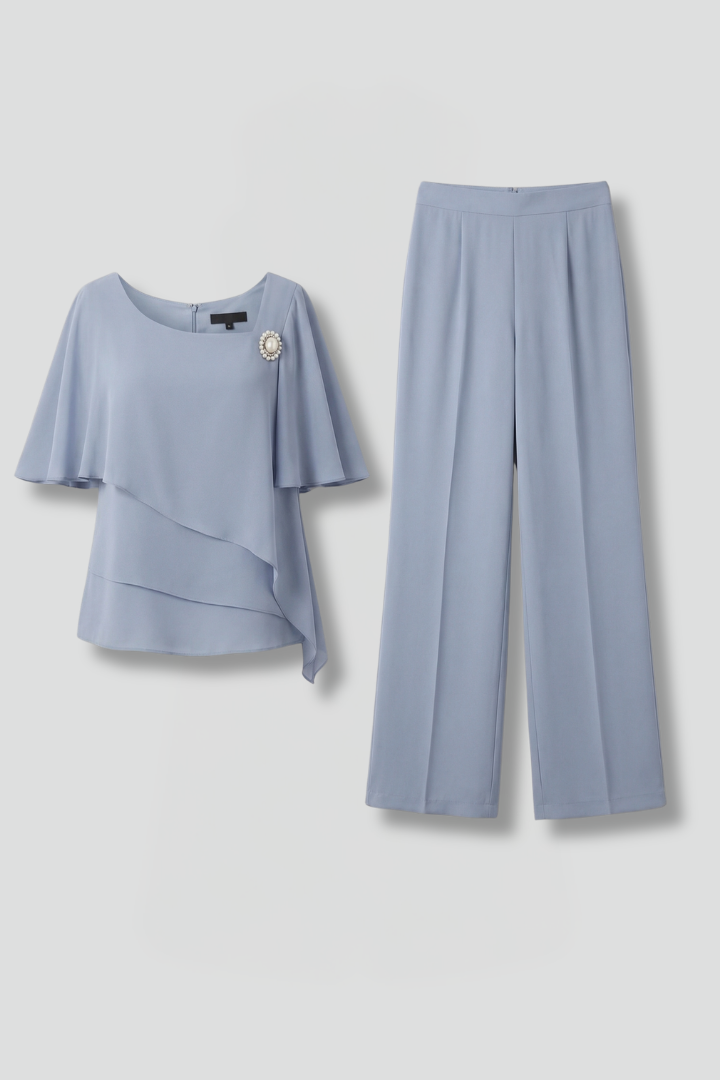 Women's chic navy blue two-piece set with a layered top & straight leg trousers for elegant summer fashion.