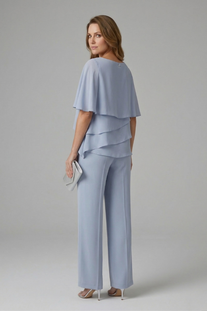 Elegant navy blue women's two-piece set with a stylish layered top and comfortable straight leg pants for summer wear.