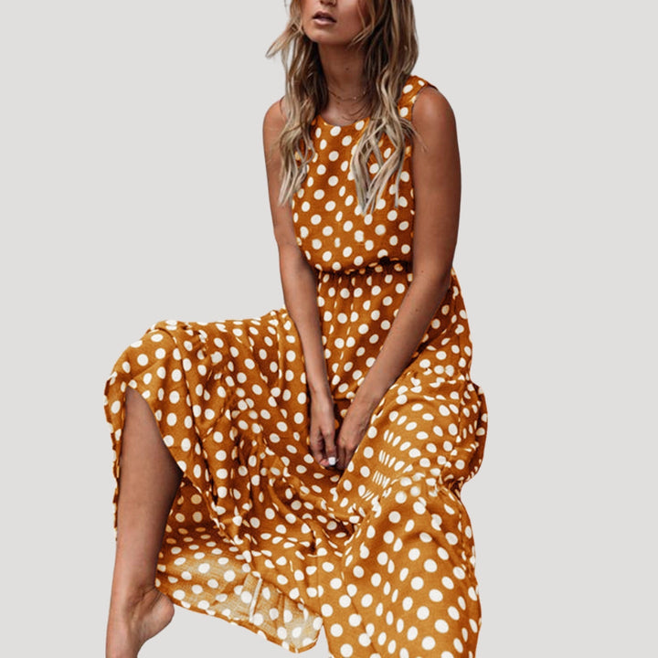 Elegant women's sleeveless A-line midi dress featuring a classic polka dot pattern. Versatile casual day dress.