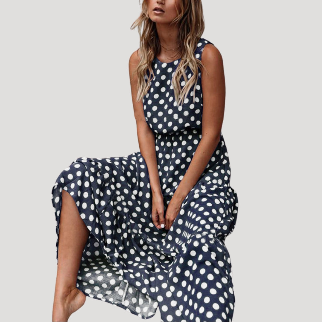 Chic women's polka dot midi dress, sleeveless with a flowy A-line silhouette. Perfect summer casual day dress.