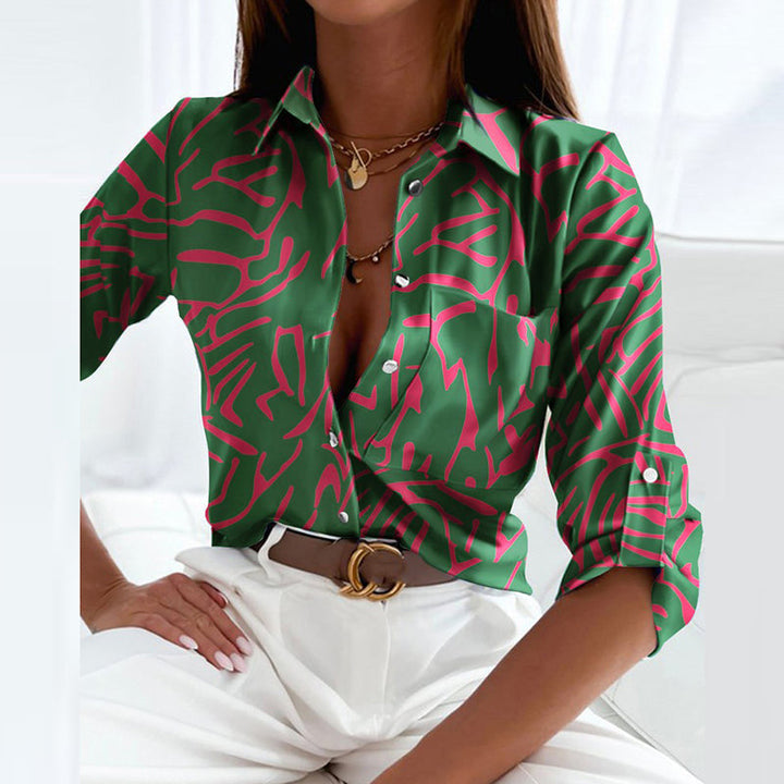 Product shot: Women's chic long sleeve button-down blouse with unique print.
