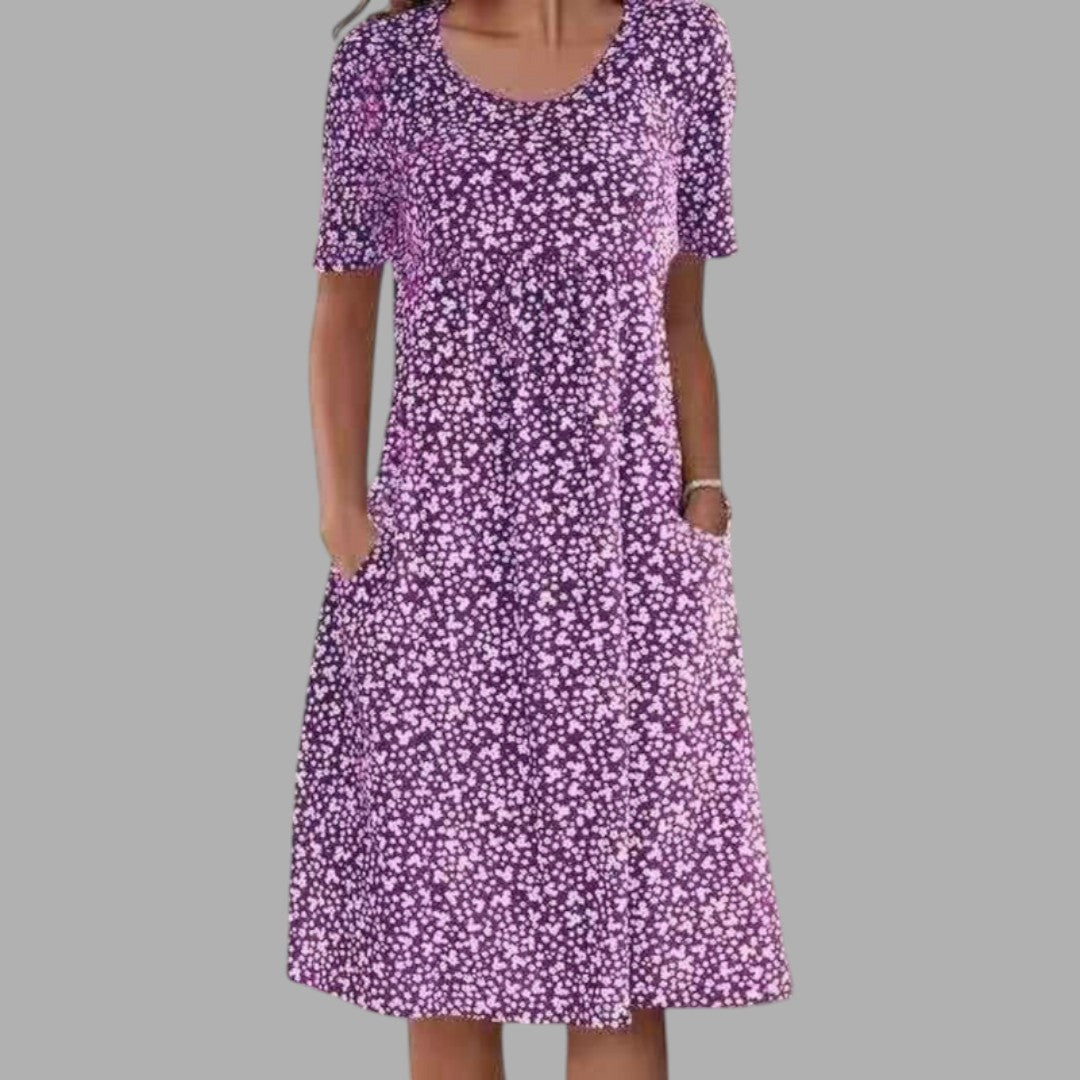 Beautiful women's midi dress with an elegant print, perfect for chic summer events & occasion wear.