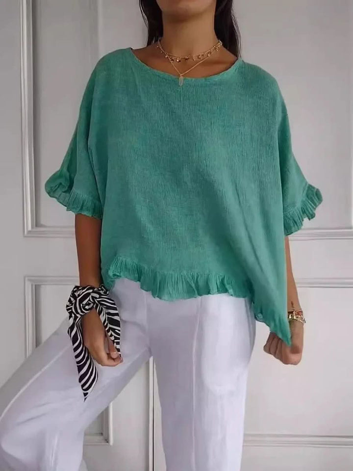 Lightweight summer ruffle blouse for women. A comfortable and chic top for warm weather fashion.