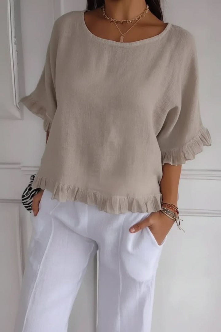 Stylish women's blouse with delicate ruffles. An elegant and versatile top for various occasions.