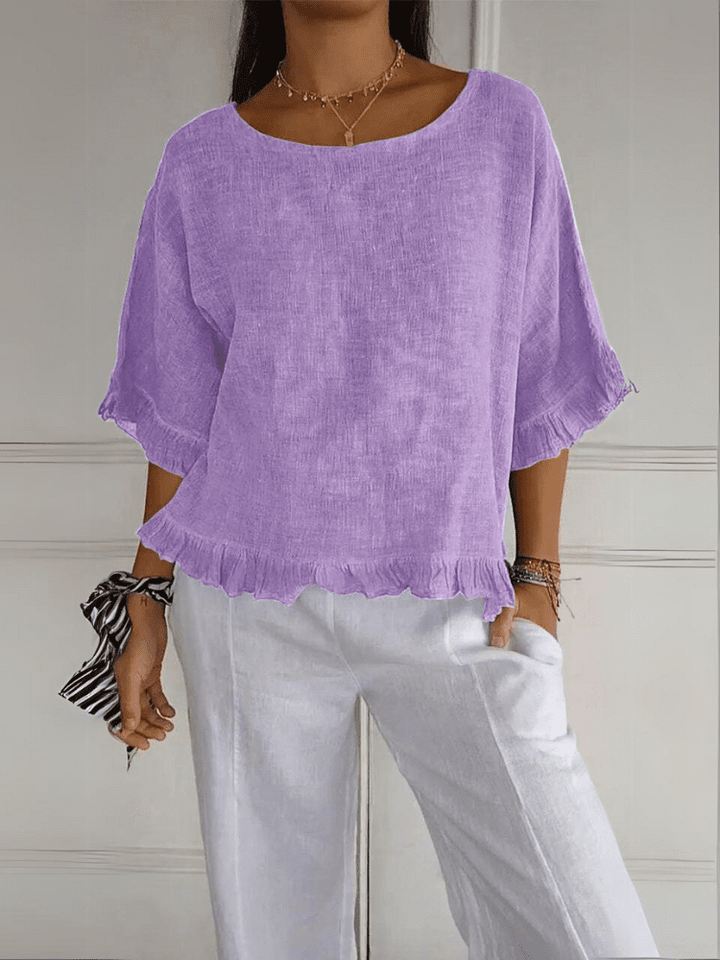 Fashionable women's ruffle top. Chic blouse, ideal for work, casual outings, or elegant events.