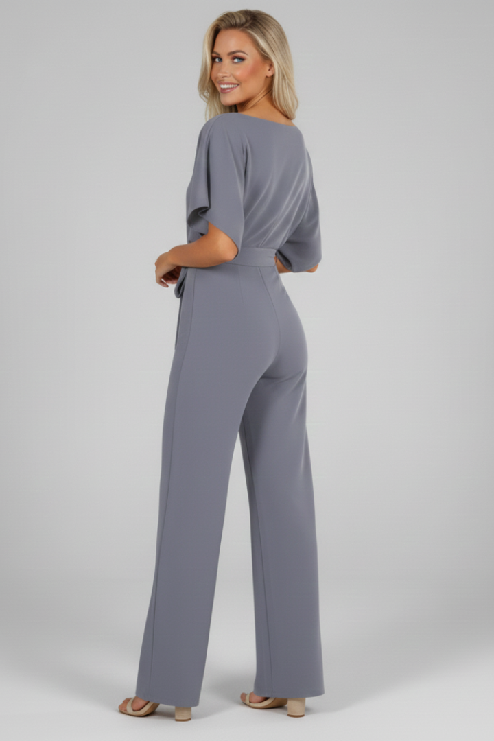 Relaxed fit women's short sleeve jumpsuit with adjustable waist tie. Comfortable, chic, and modern for summer.