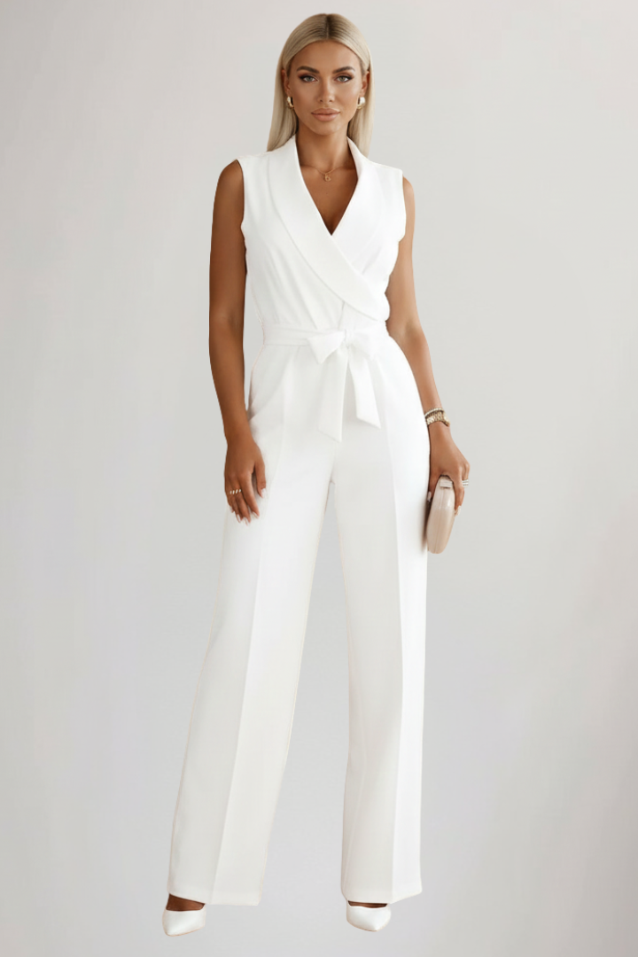 Model in stylish women's sleeveless V-neck jumpsuit with a tie waist & wide legs, ideal for summer.