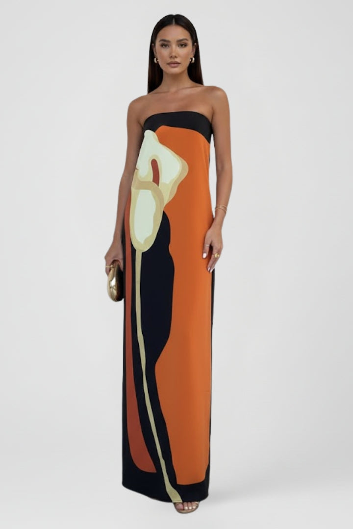 Women's colorful strapless maxi dress with an abstract print, ideal for beach trips & vacations.