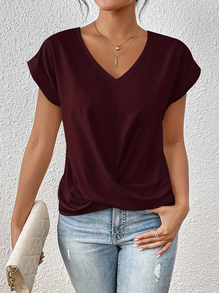 Comfortable women's short sleeve V-neck top. Features a flattering twist-front for all-day style.