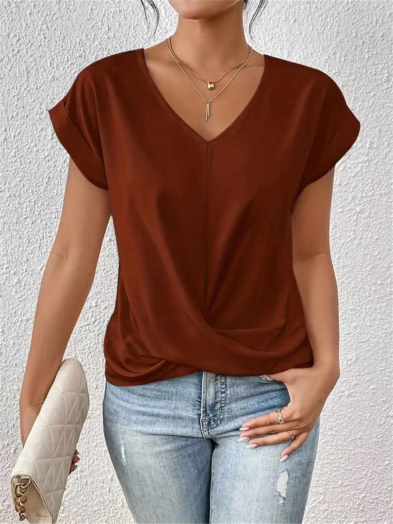 Stylish women's fashion V-neck blouse. Chic twist-front and short sleeves, perfect for summer.