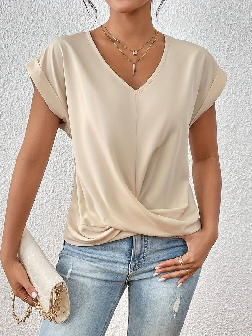 Chic women's short sleeve V-neck top with a flattering twist-front. Ideal for day-to-night versatile style.