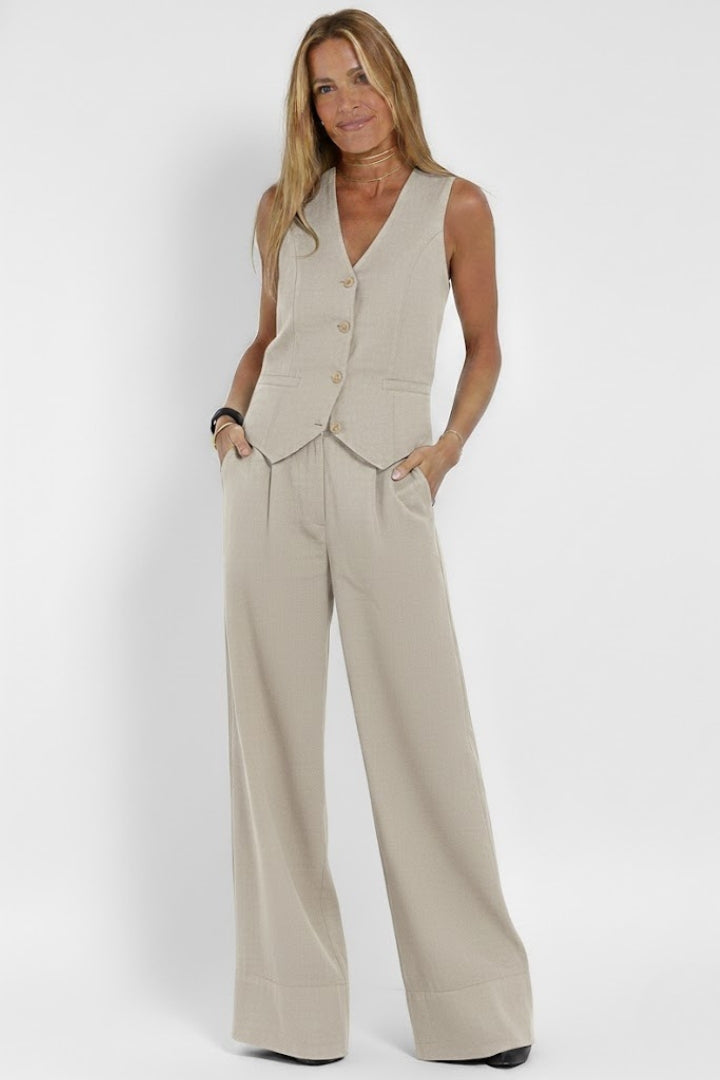 Elegant women's matching set with a stylish waistcoat and comfortable wide-leg trousers. Versatile fashion.