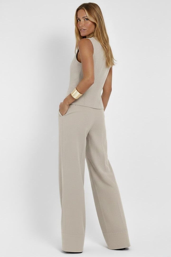 Sophisticated women's two-piece ensemble with an elegant waistcoat and flattering wide-leg trousers.