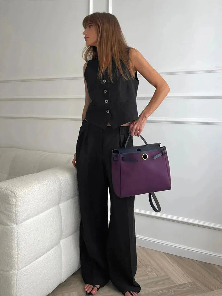 Fashionable women's two-piece set featuring a chic waistcoat and comfortable, relaxed-fit wide-leg trousers for elegance.