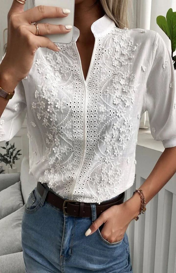 Elegant V-neck women's top, great for office wear, evening events, or stylish casual outings. Short sleeve.