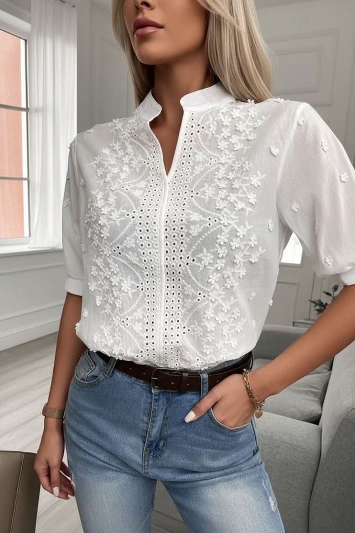Chic women's short sleeve V-neck top for summer style. Elegant and comfortable for versatile everyday wear.