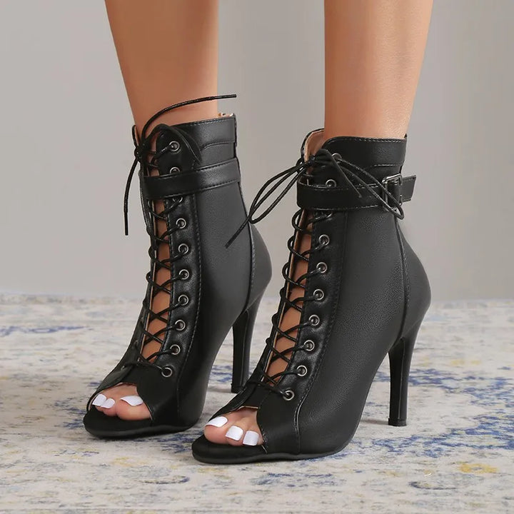 Women's classic black lace-up stiletto heels with open toe and ankle strap, elegant party shoes.