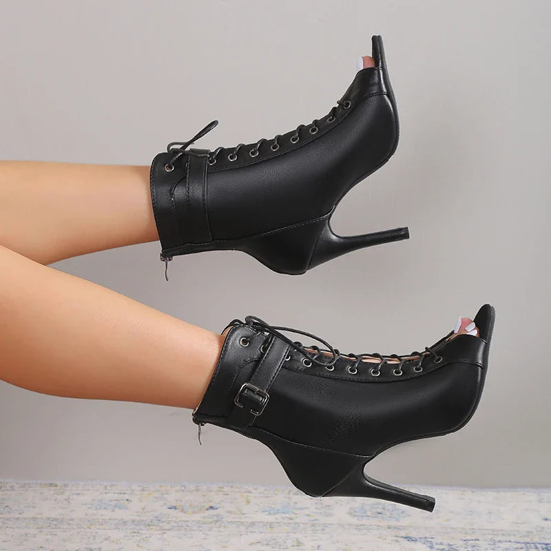 Elegant women's footwear: black lace-up stiletto heels, open-toe design for a sophisticated look.