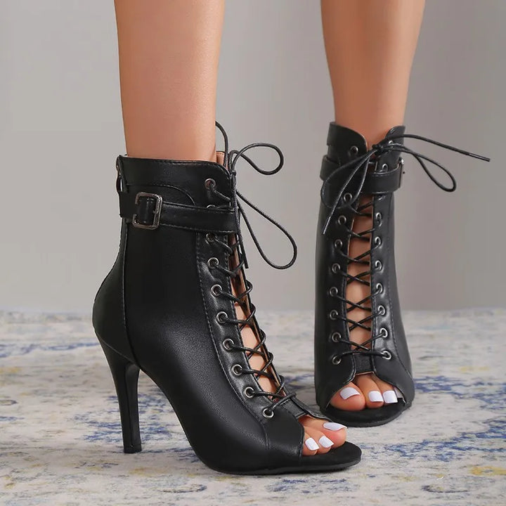 Fashionable black stiletto heels for women, featuring a lace-up design and chic ankle strap.