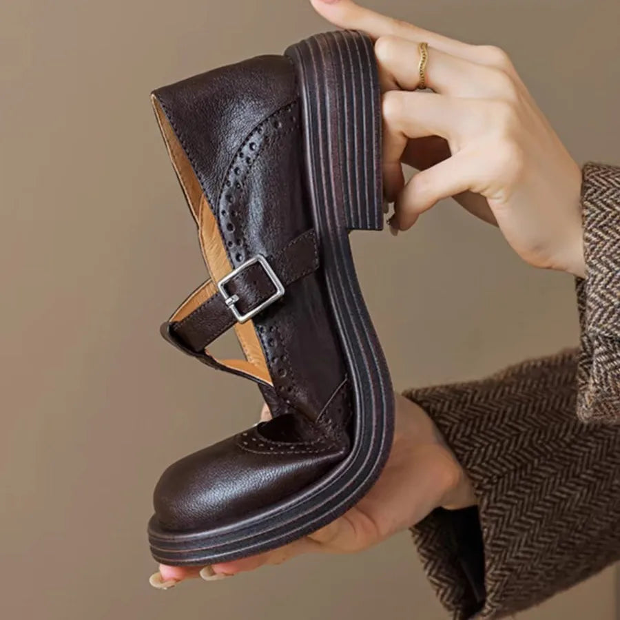 Vintage-inspired women's black leather T-strap flats, perfect for elegant everyday comfort.
