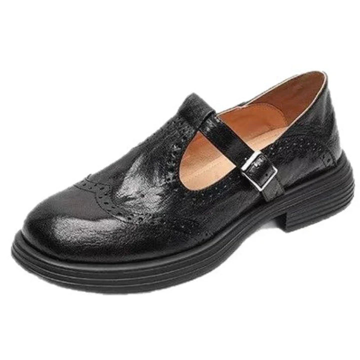 Classic women's leather T-strap shoes with a comfortable flat sole, timeless and versatile.