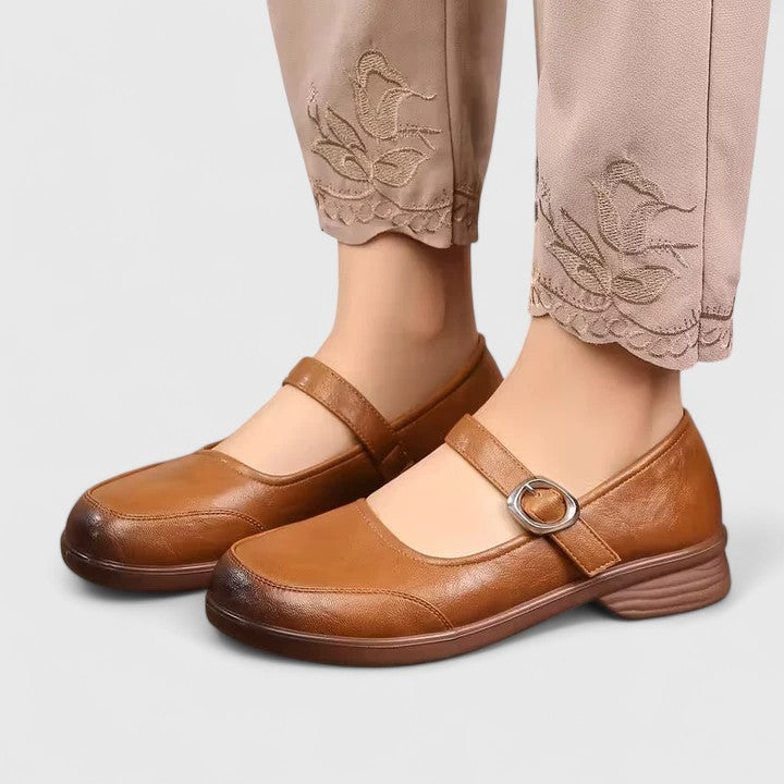 Women's flat buckle shoes styled with a summer dress, emphasizing comfort