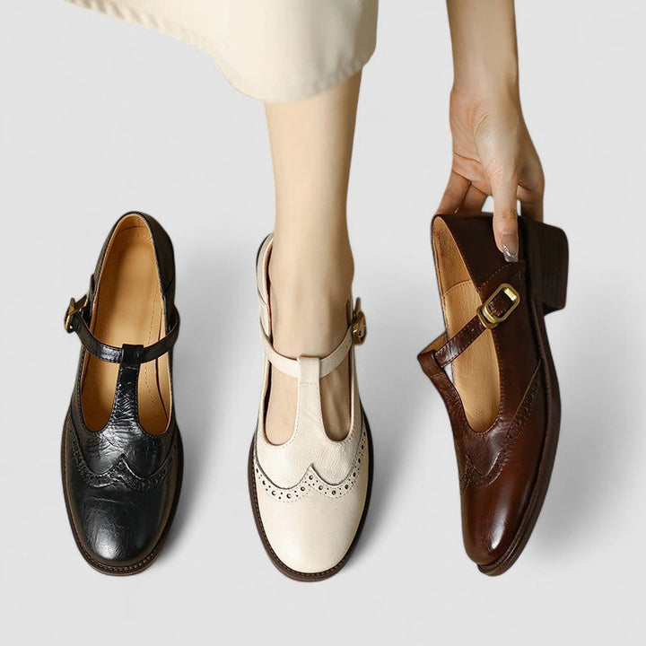 Close-up of classic black Mary Janes with a silver buckle strap, perfect for versatile casual wear