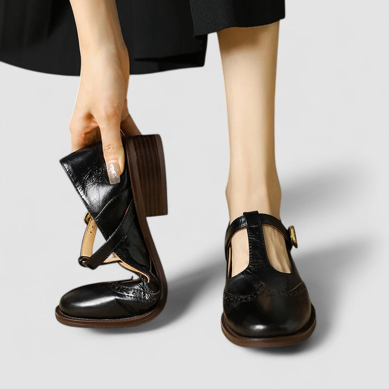 Top-down view of black classic buckle strap Mary Janes, essential casual footwear for women