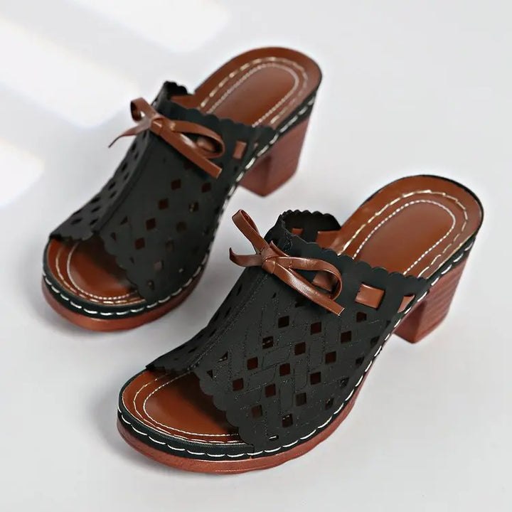 Classic open-toe block heel mules for women, designed with attractive scalloped cutouts.