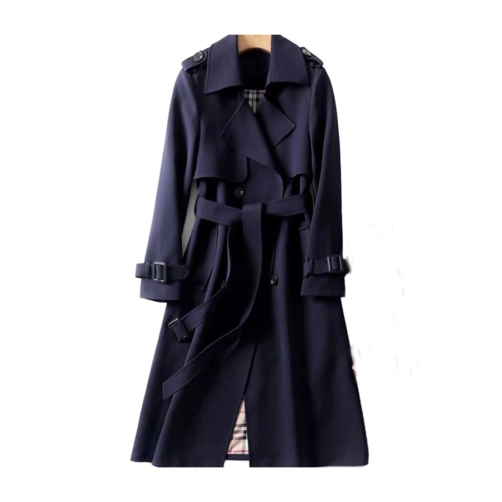Stylish women's double-breasted long trench coat with a cinched belt, a timeless fall fashion staple.