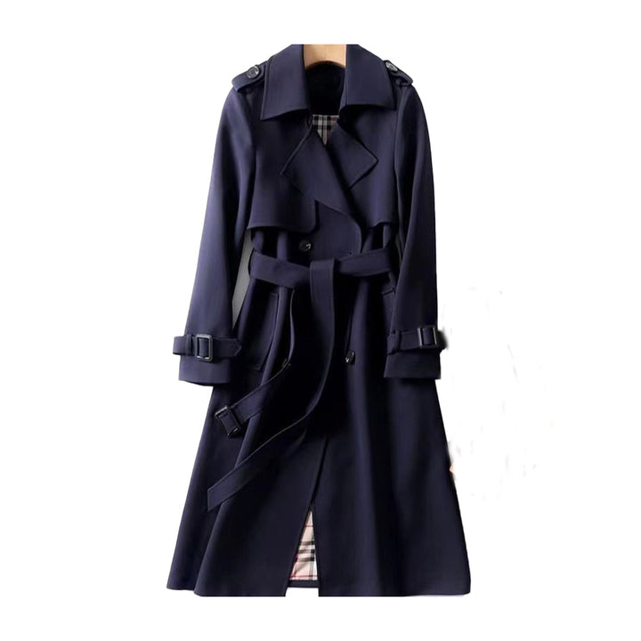 Stylish women's double-breasted long trench coat with a cinched belt, a timeless fall fashion staple.