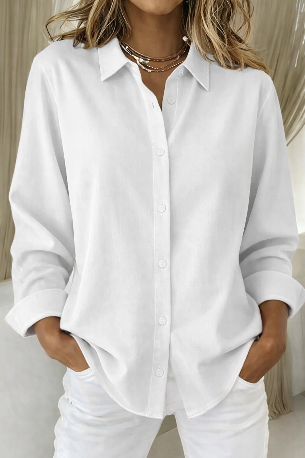 Chic women's long sleeve button-up shirt with a relaxed fit, suitable for professional office wear & stylish ensembles.