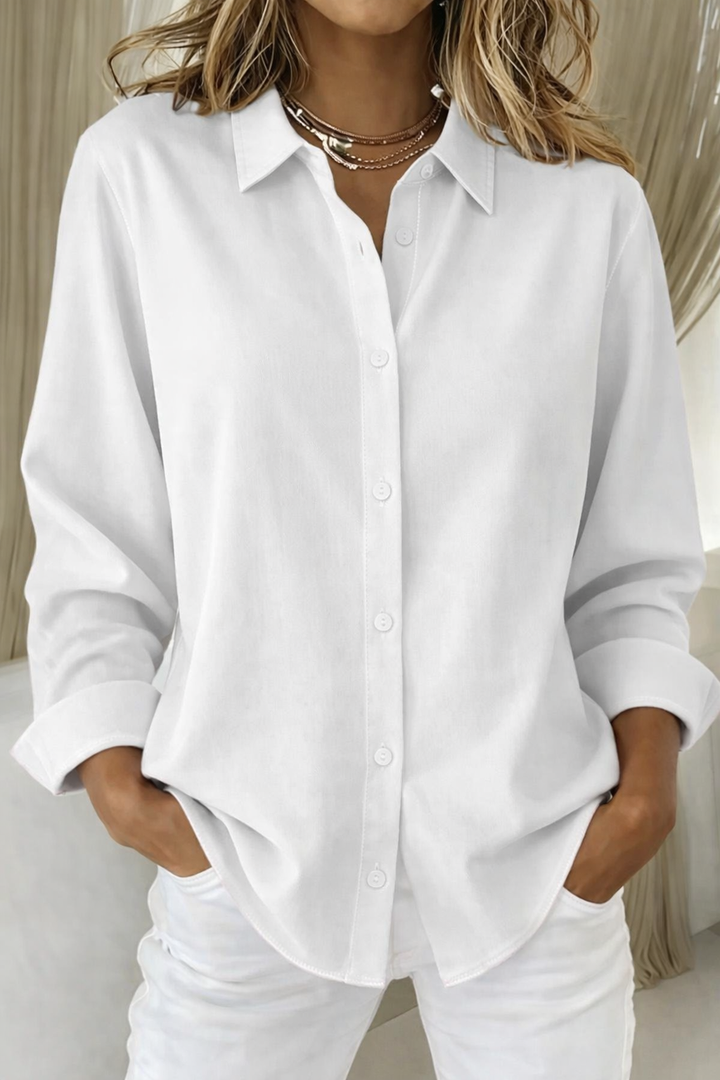 Chic women's long sleeve button-up shirt with a relaxed fit, suitable for professional office wear & stylish ensembles.