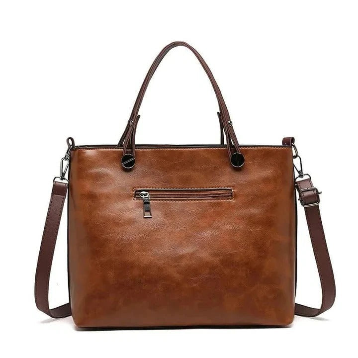 Women's classic minimalist leather handbag, versatile for daily or professional use.