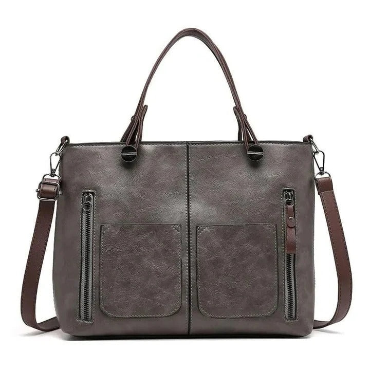 Classic women's leather crossbody bag with minimalist design, perfect for professional or daily use.