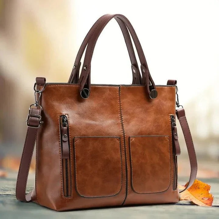 Versatile women's leather handbag; minimalist classic design, suitable as a shoulder or crossbody bag.