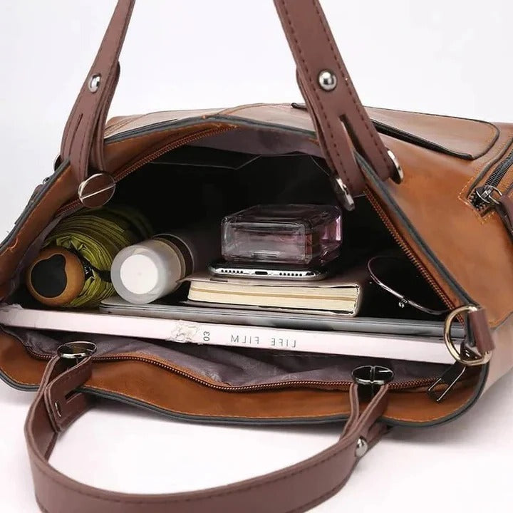 Professional & elegant women's leather handbag, classic minimalist design, ideal shoulder or crossbody.
