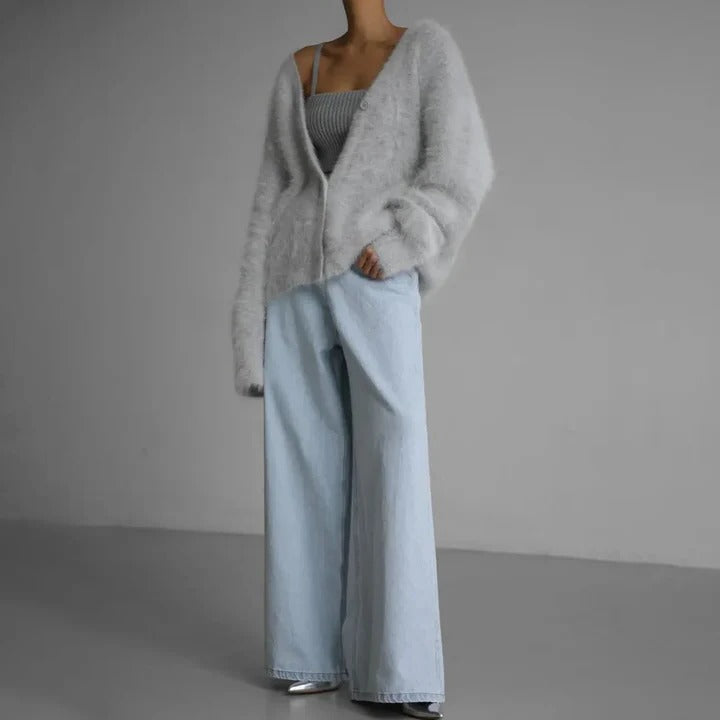 Women's warm knitwear, a classic round neck winter sweater. Soft feel long sleeve top for cozy comfort.