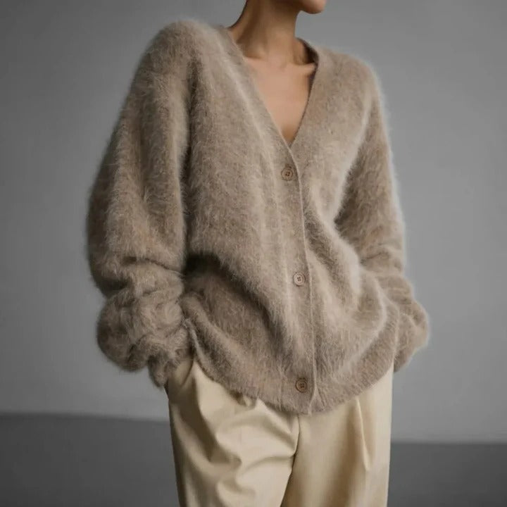 Classic women's round neck knit sweater. Soft, cozy, long sleeve winter top for elegant and versatile comfort.