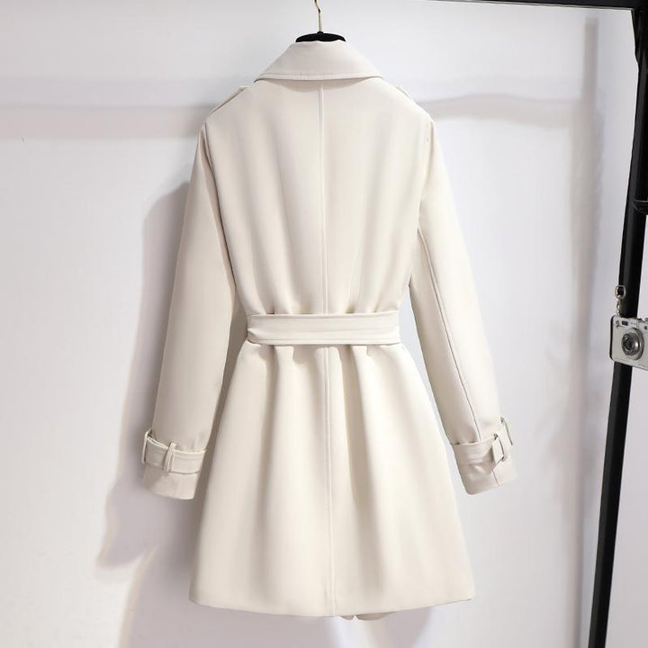 Sophisticated women's long sleeve white trench coat with a belt and classic lapel detailing