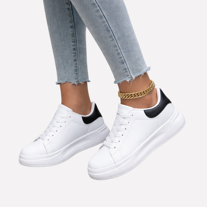 Women's classic white casual sneakers, low-top design for versatile everyday style and comfort.