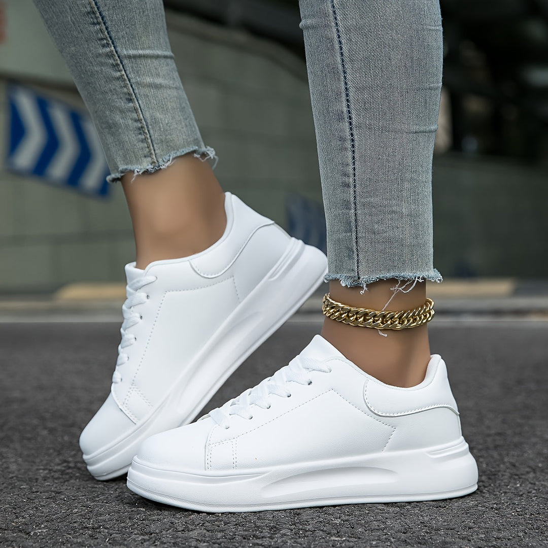 Comfortable women's low-top white sneakers, ideal for casual wear, offering versatile and modern everyday style.