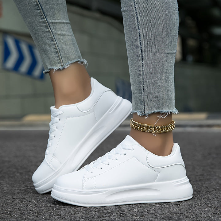 Comfortable women's low-top white sneakers, ideal for casual wear, offering versatile and modern everyday style.