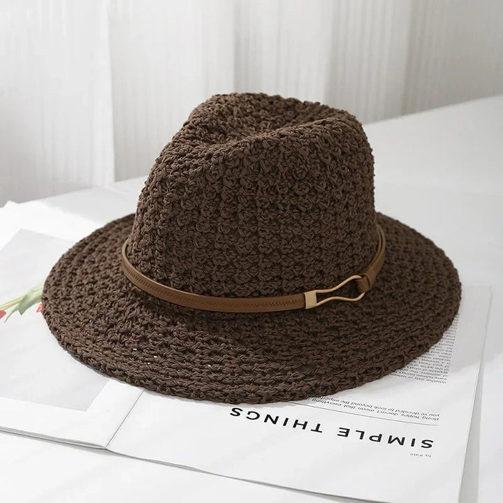 Women's fedora hat, a timeless woven design, complete with a distinctive faux leather trim.
