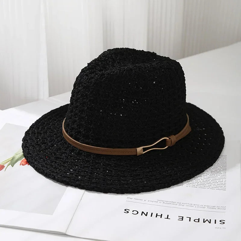 Elegant women's summer hat: a woven fedora with a contrasting faux leather band.