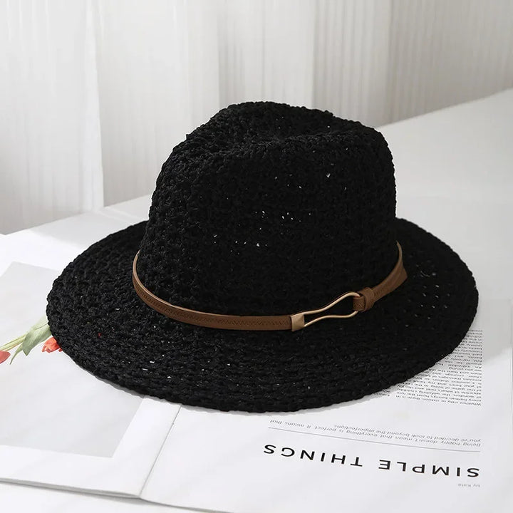 Elegant women's summer hat: a woven fedora with a contrasting faux leather band.